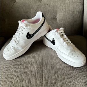 A pair of women’s NIKE COURT VISION shoes